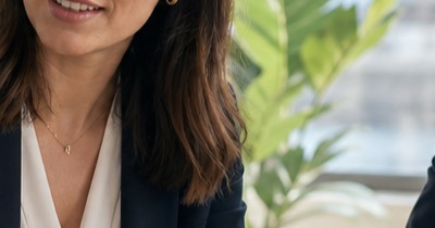 Recruiter meeting with a candidate and employer in a modern Malta office