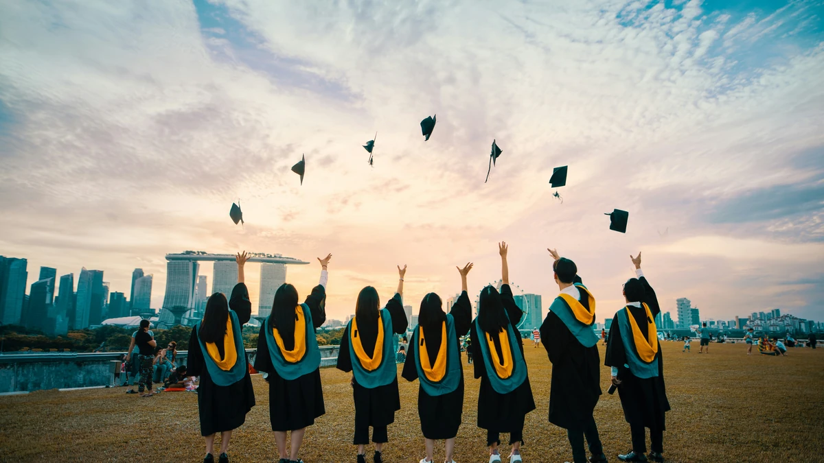 Students celebrating graduation by throwing caps — Study in Malta 2026 | Outreach Recruitment