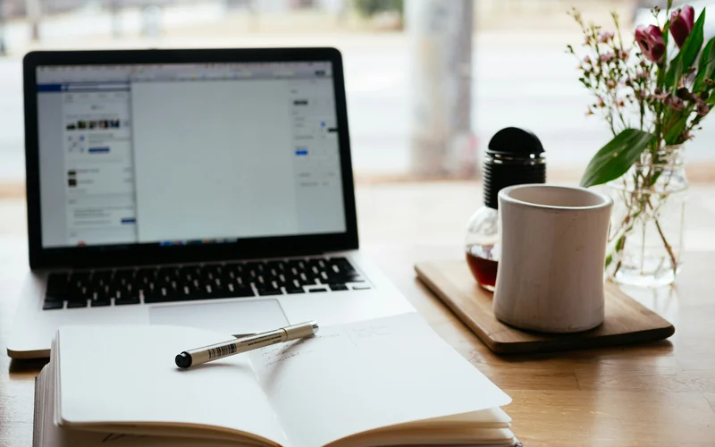 Student planning study budget in Malta with laptop — cost of studying in Malta 2026 | Outreach Recruitment